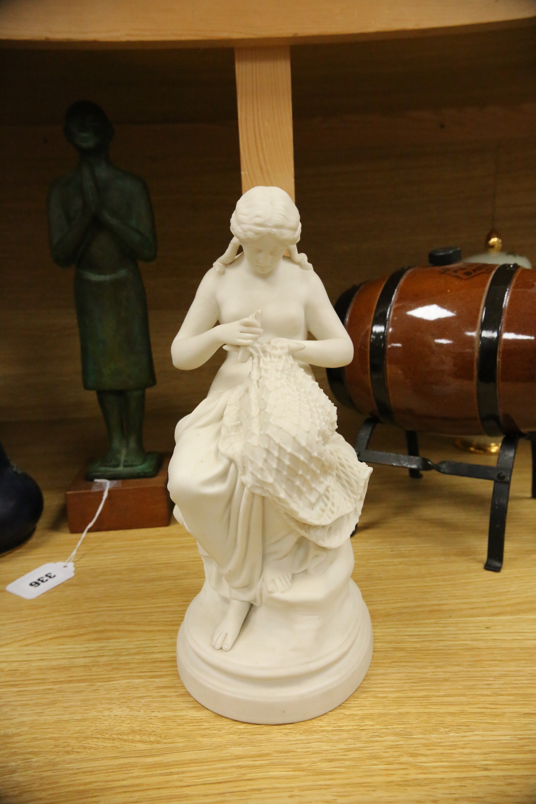 A Parian porcelain figure of a girl mending a fishing net, a Carltonware jar and cover, a “Pedestrian Barrelette” on stand and thirteen various Art Nouveau metal trays, dishes and candlestick including WMF etc, largest t